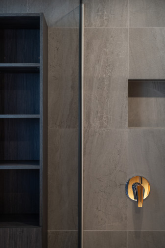 modern bathroom renovation gray tiles glass shower round mirror6