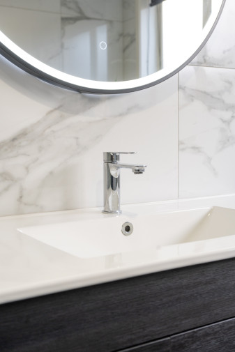 modern bathroom renovation sleek faucet marble tile 1